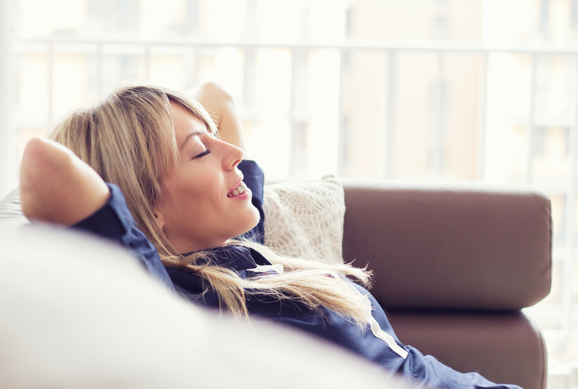 Relaxed Young Woman Lying On Couch Neis Insurance 